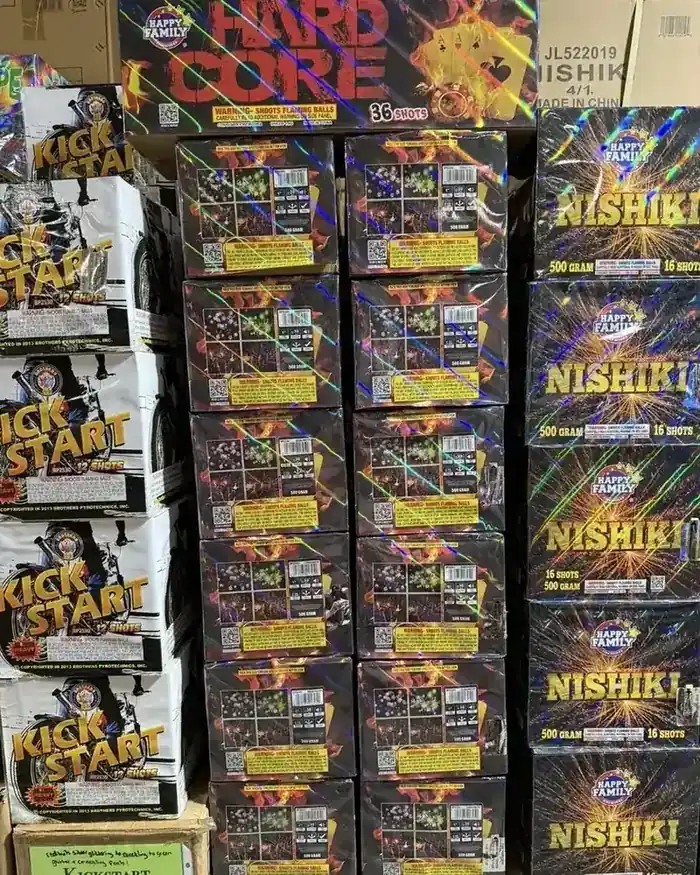 Hard Core, Nishiki, and Kick Start fireworks stacked in the showroom